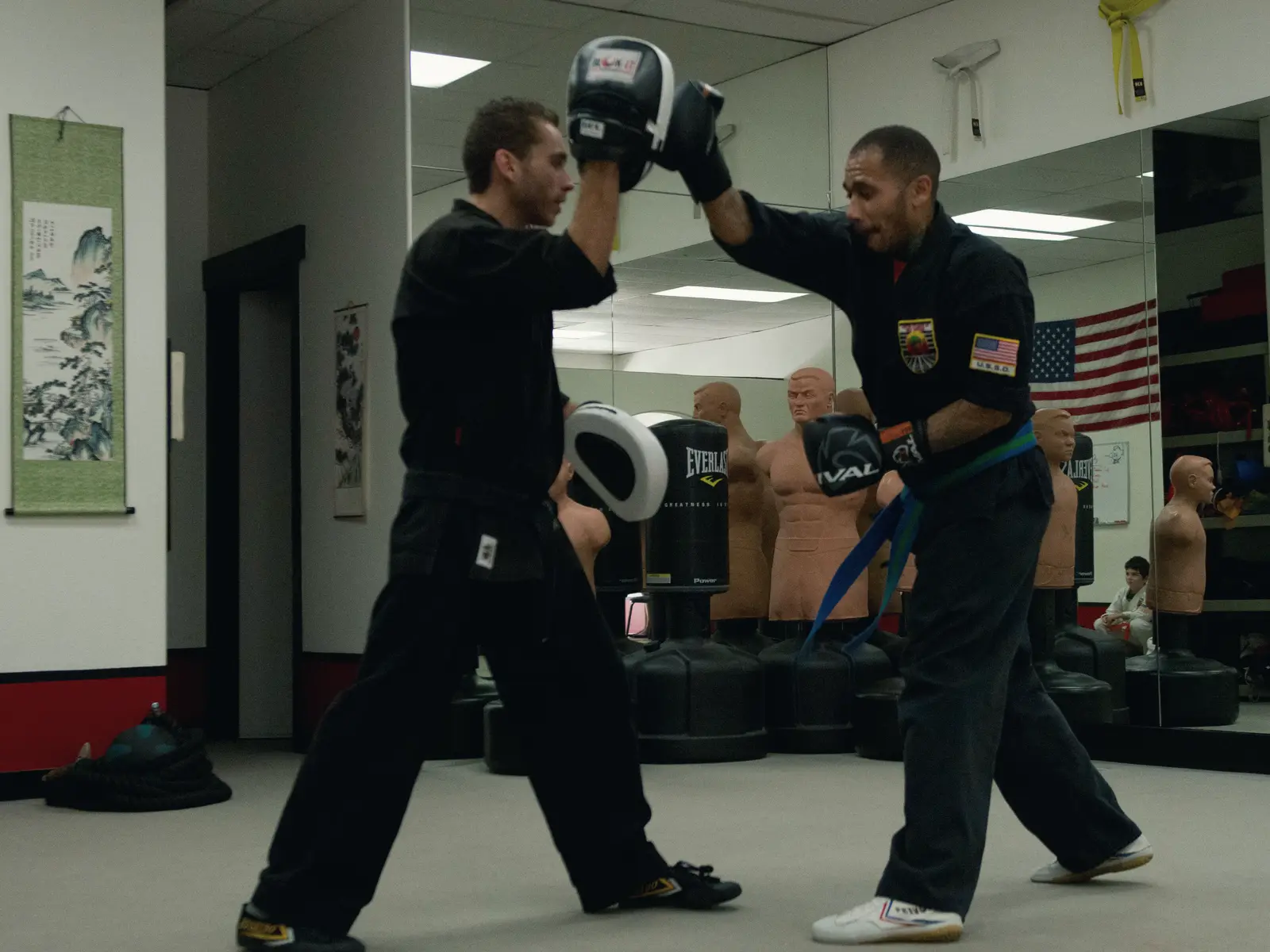 Two adult students working focus mitts during a class at USSD Santa Barbara.