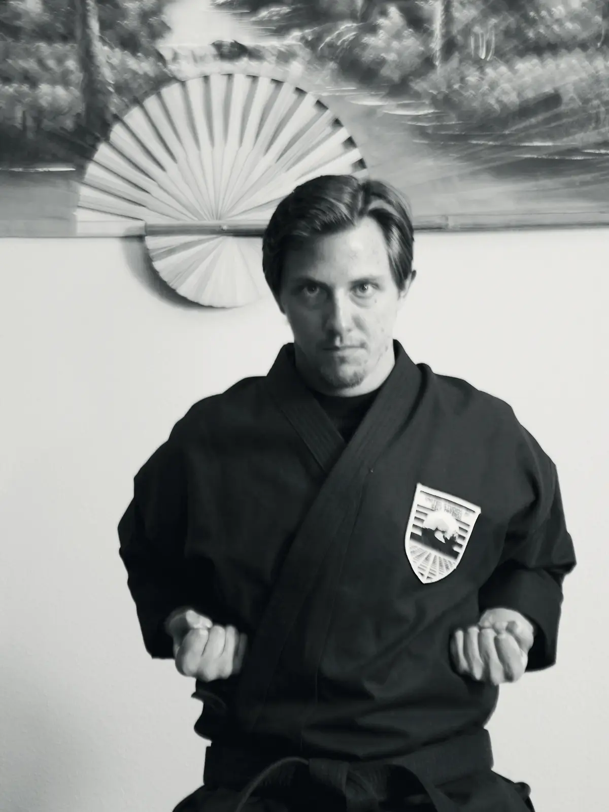 An instructor at USSD Santa Barbara facing the camera in a black uniform during a lesson.