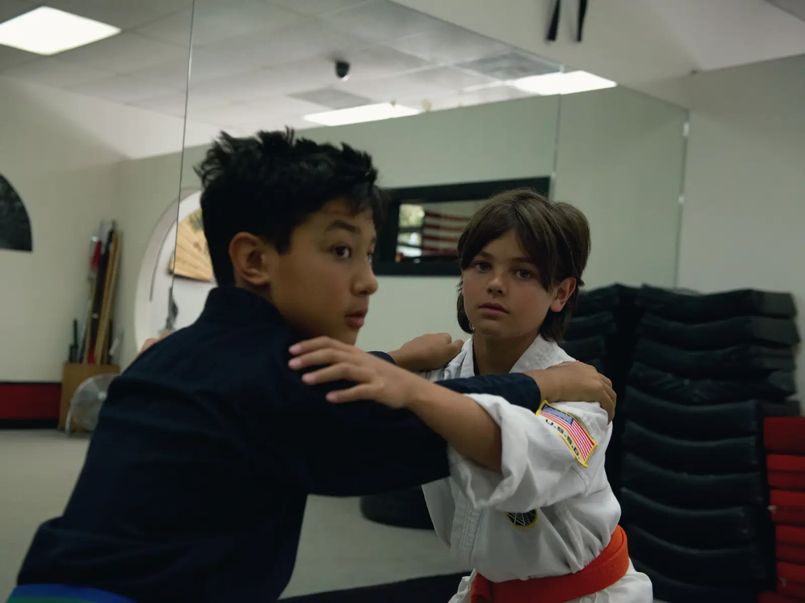 Two students working a partner escape technique closely during a private lesson at USSD Santa Barbara.